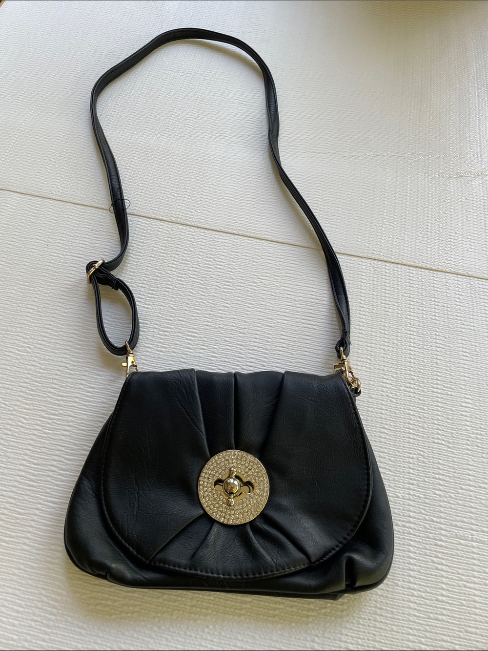 Black Women's Shoulder Bag with Decorative Medallion
